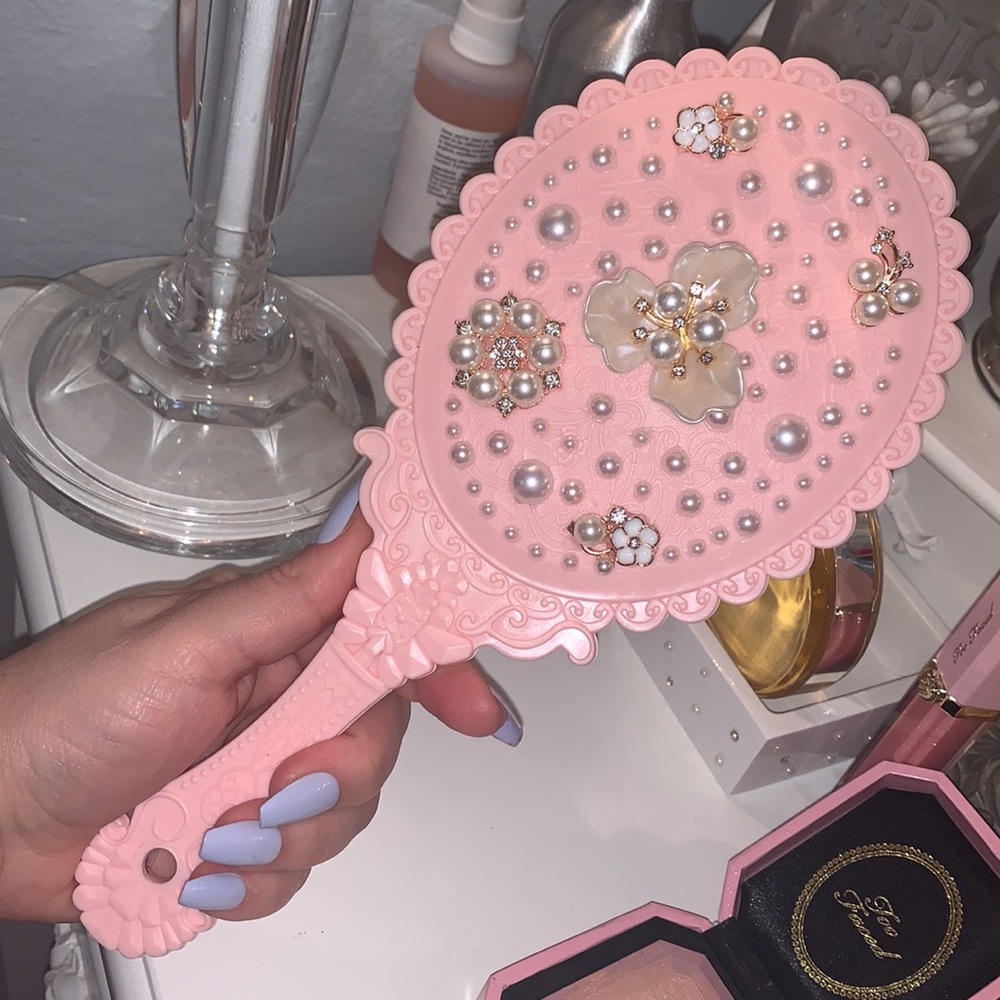 Pink hand mirror with pearls
